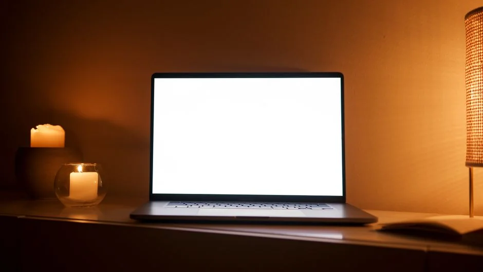 A modern computer screen displaying web design work, showcasing creative visuals in a workspace.